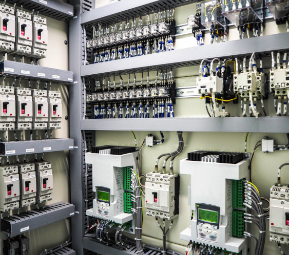 Technician inspecting flood damaged control panel – SAL ELECTRONICS